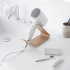 Hair dryer being stored on ash Yamazaki Home Hair Dryer and Iron Stand on a bathroom counter
