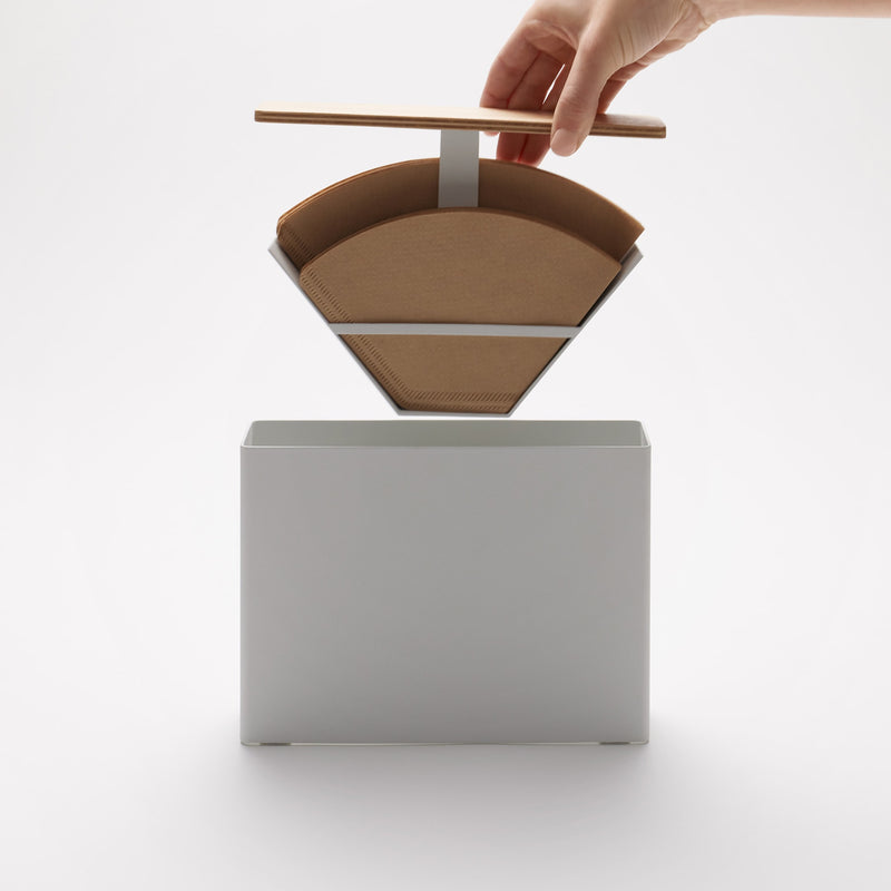 Yamazaki Home Coffee Filter Case - Size 04 with props, set against a white background.