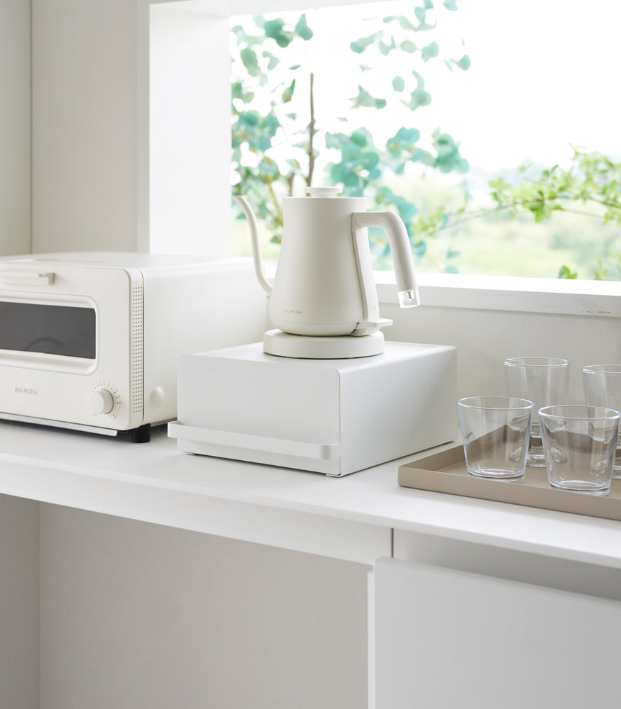 View 2 - Yamazaki Home White Countertop Rack with Drawer with a kettle next to a toaster oven.