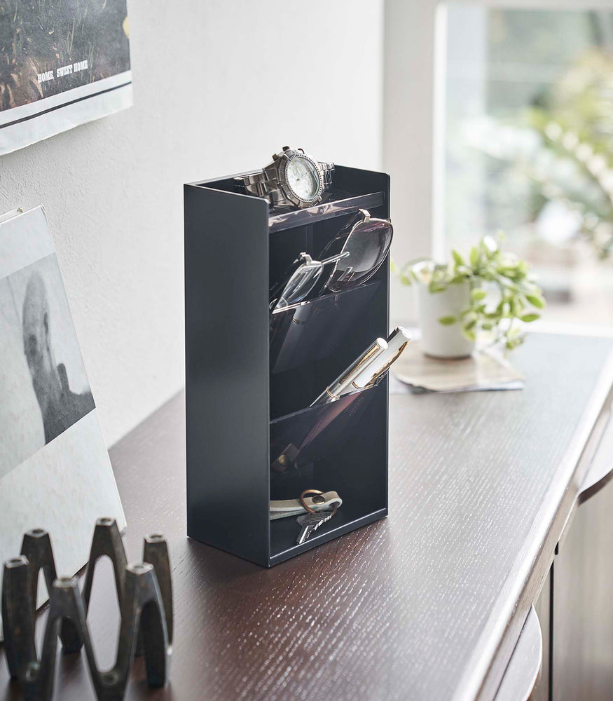 View 8 - black Yamazaki Home Accessory Organizer holding accessories such as pens and a watch