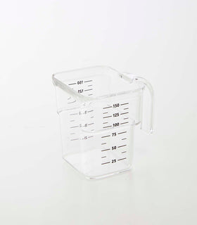 Clear measuring cup on white background by Yamazaki Home. view 43