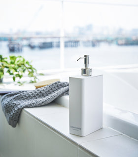 White Conditioner Dispenser in bathroom by Yamazaki Home. view 12