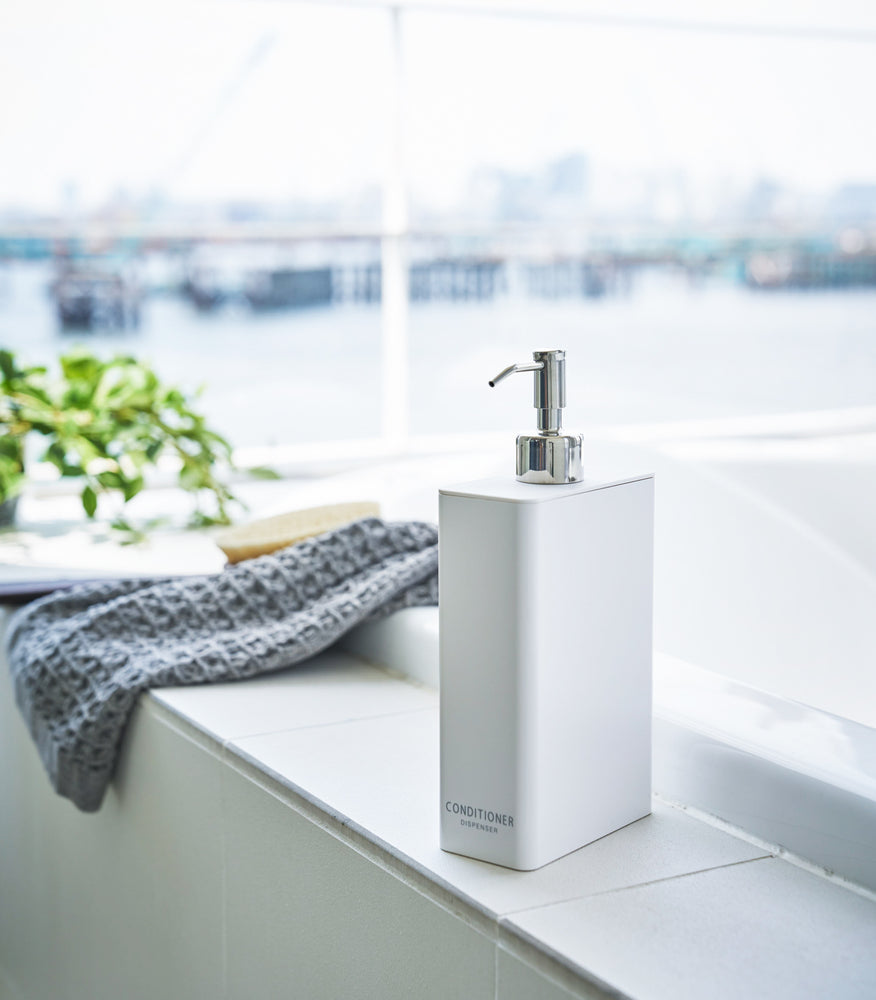 View 12 - White Conditioner Dispenser in bathroom by Yamazaki Home.