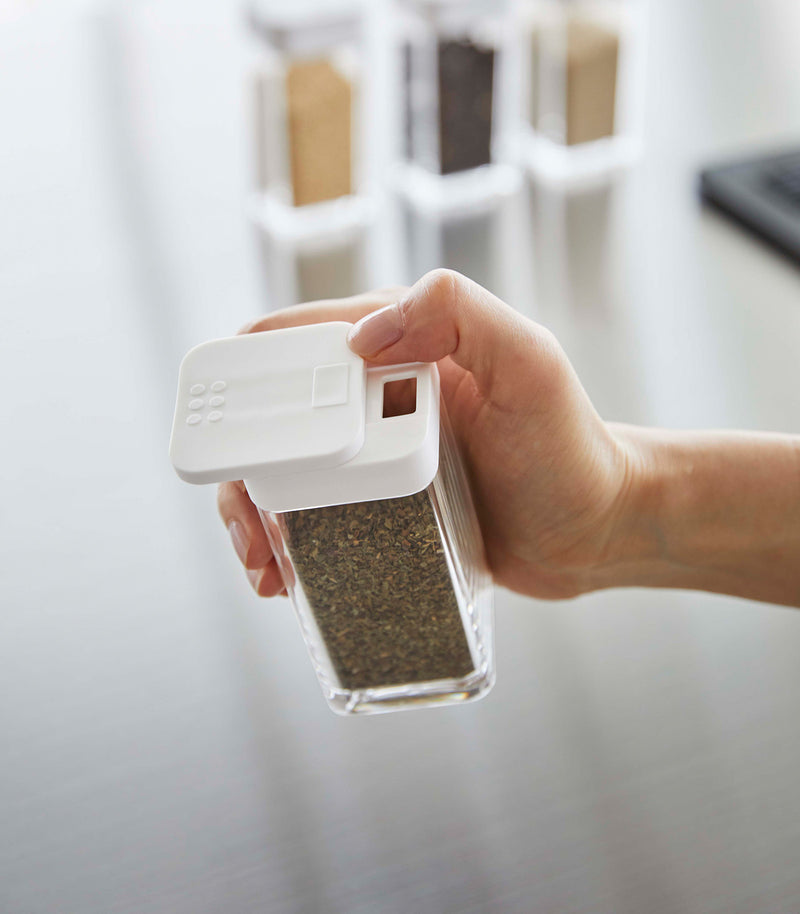 White Yamazaki Home Spice Jar being opened with the wide slot