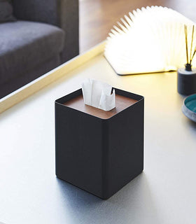 Black Tissue Case on coffee table by Yamazaki Home. view 10