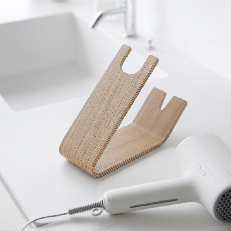 Ash Yamazaki Home Hair Dryer and Iron Stand with hair dryer nearby