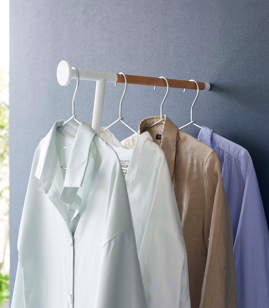View 4 - Collared shirts hung on white Yamazaki Home Clothes Steaming Leaning Pole Hanger