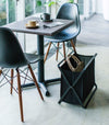 Black Storage Hamper holding purse by Yamazaki Home.
