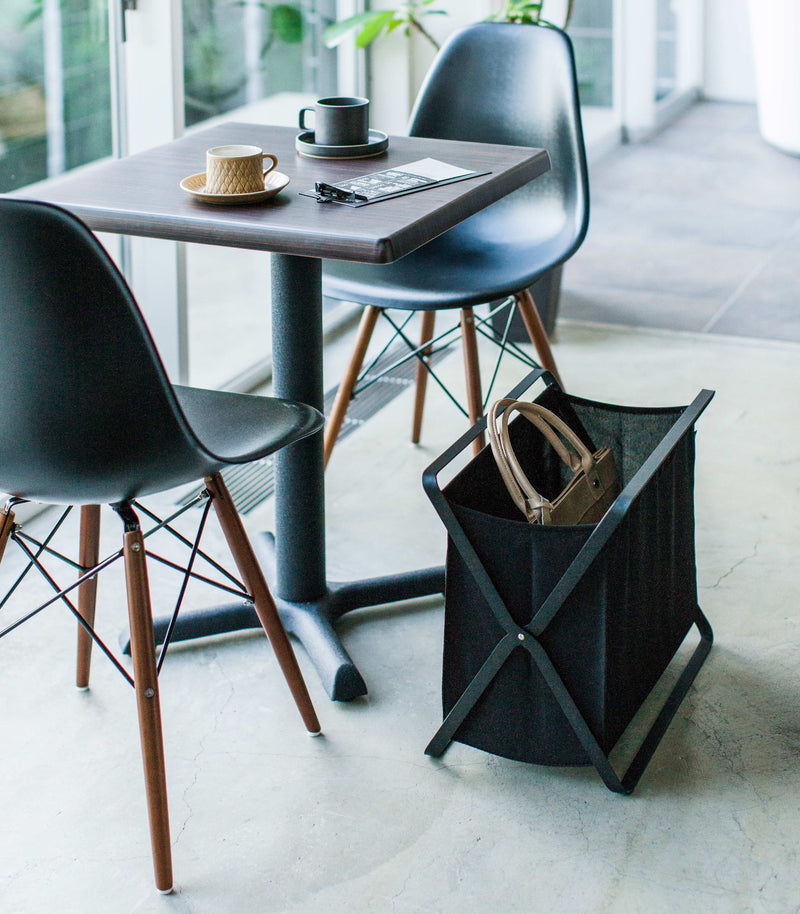 Black Storage Hamper holding purse by Yamazaki Home.