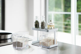 White Pantry Organizer with upper shelf holding ingredients on kitchen countertop by Yamazaki Home. view 3