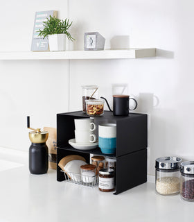 Black Stackable Countertop Shelves stacked together holding coffee brewing accessories on kitchen counter by Yamazaki Home. view 25
