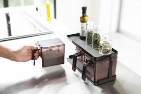 Black Pantry Organizer holding baking ingredients and spices on upper shelf by Yamazaki Home. view 9