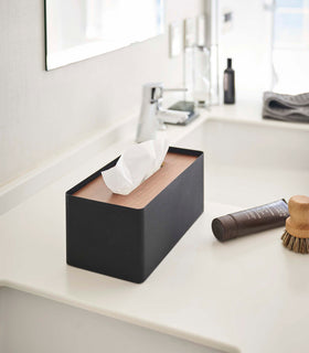 Black Tissue Case with lid off holding tissues by Yamazaki Home. view 22
