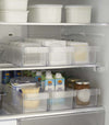 Yamazaki Refridgerator Organizer Bins in refridgerator full of food