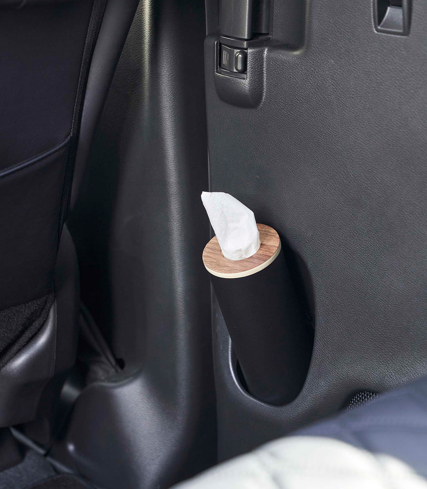 View 13 - Small black Yamazaki Home Round Tissue Case in a car door cup holder