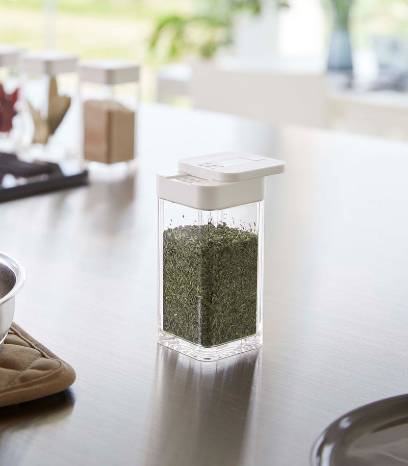 White Yamazaki Home Spice Jar opened with the slotted side