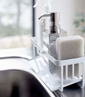 Profile of white steel sponge and soap bottle holder with white draining tray. view 4