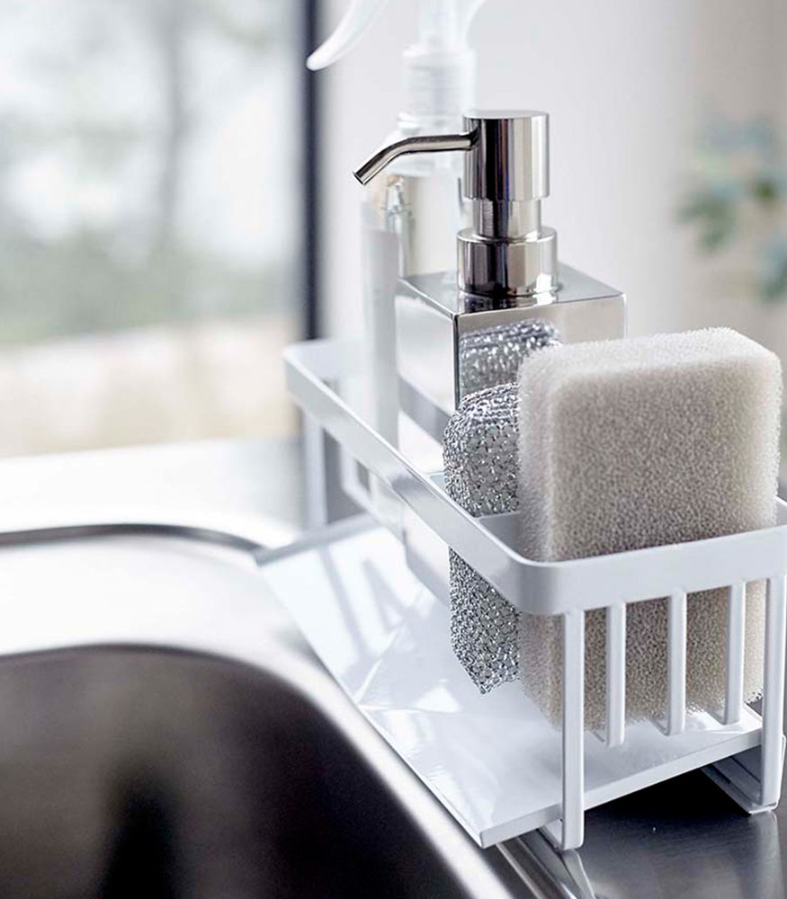 View 4 - Profile of white steel sponge and soap bottle holder with white draining tray.