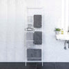 Front view of Leaning Ladder Hanger holding towels and bathroom essentials.