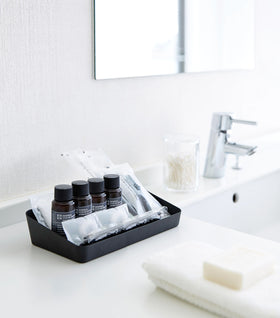 Black Accessory Tray holding beauty products in bathroom by Yamazaki Home. view 15