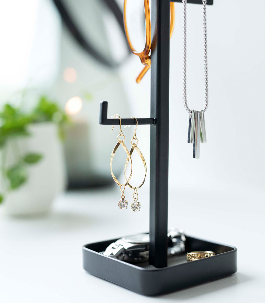 View 16 - Close up of black Yamazaki Home Tree Accessory Stand displaying earrings