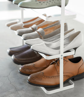 Close up view of white Shoe Rack holding shoes by Yamazaki home. view 4