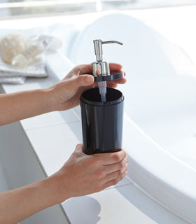 Black Body Soap Dispenser with top off in bathroom by Yamazaki Home. view 31