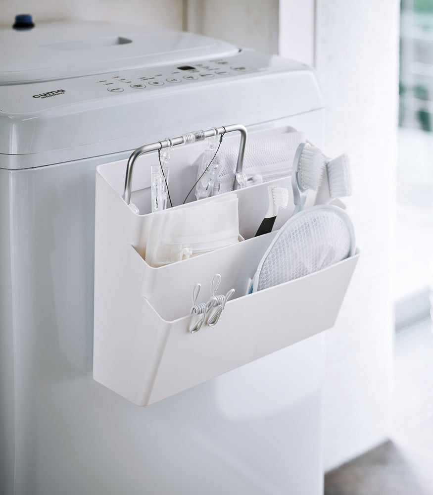 View 2 - White Magnetic Storage Caddy holding cleaning items in laundry room by Yamazaki Home.