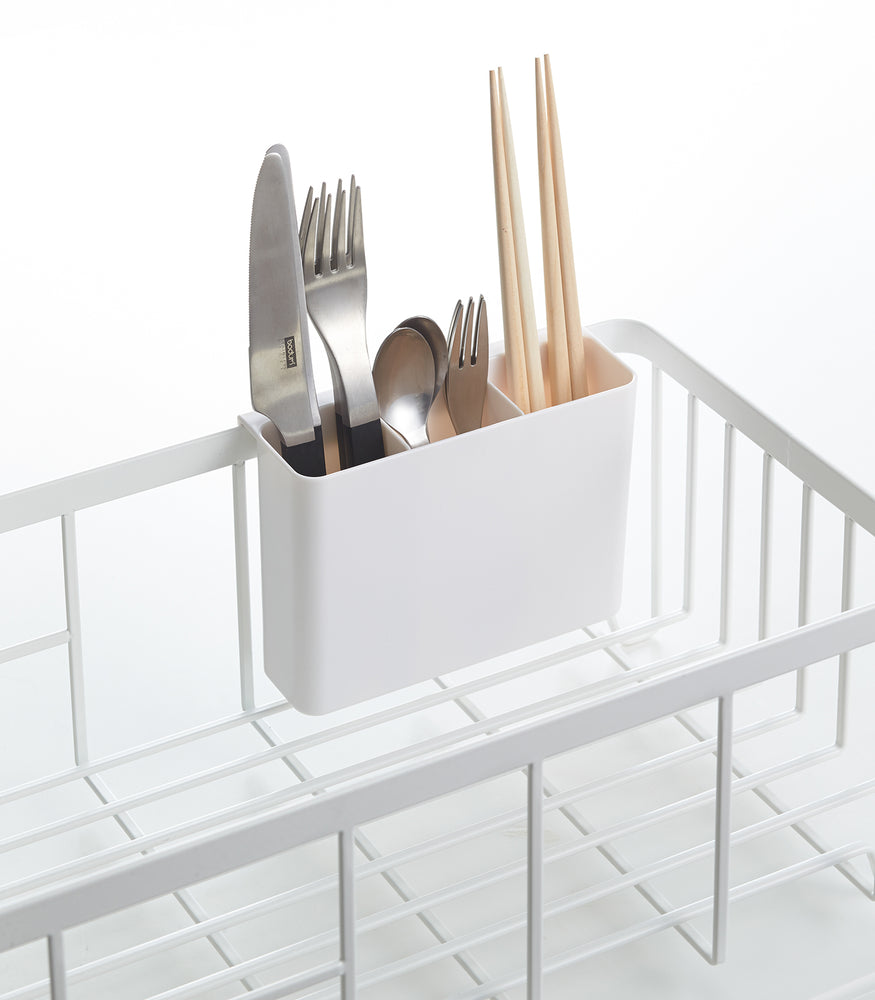 View 5 - Close up view of white Dish Rack utensil organizer holding utensils by Yamazaki Home.