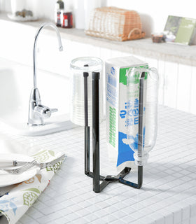 Black Collapsible Bottle Dryer on ktichen counter by Yamazaki home. view 12