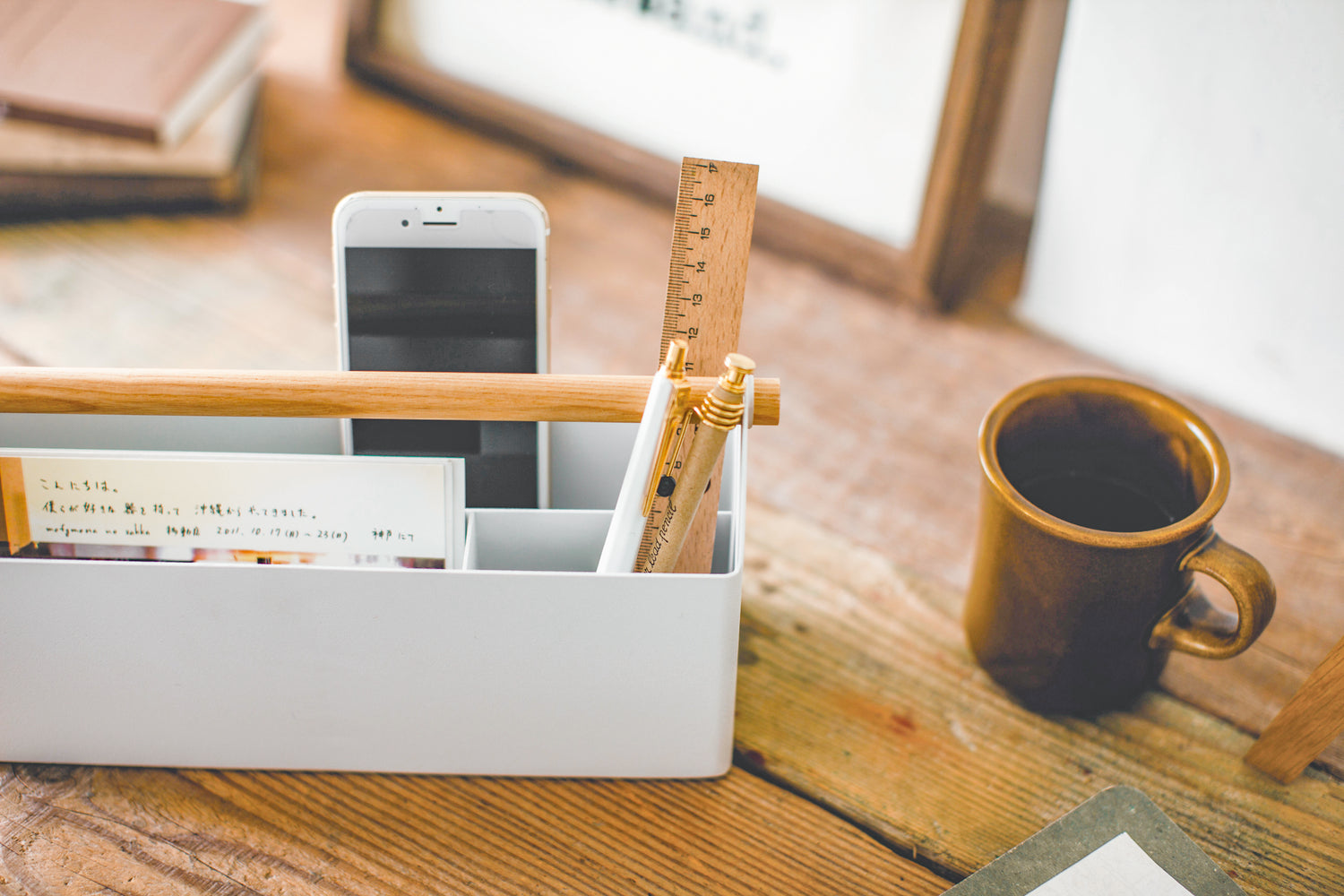 View 12 - Aerial view of white Desk Organizer holding ruler, pens and phone on counter by Yamazaki Home.