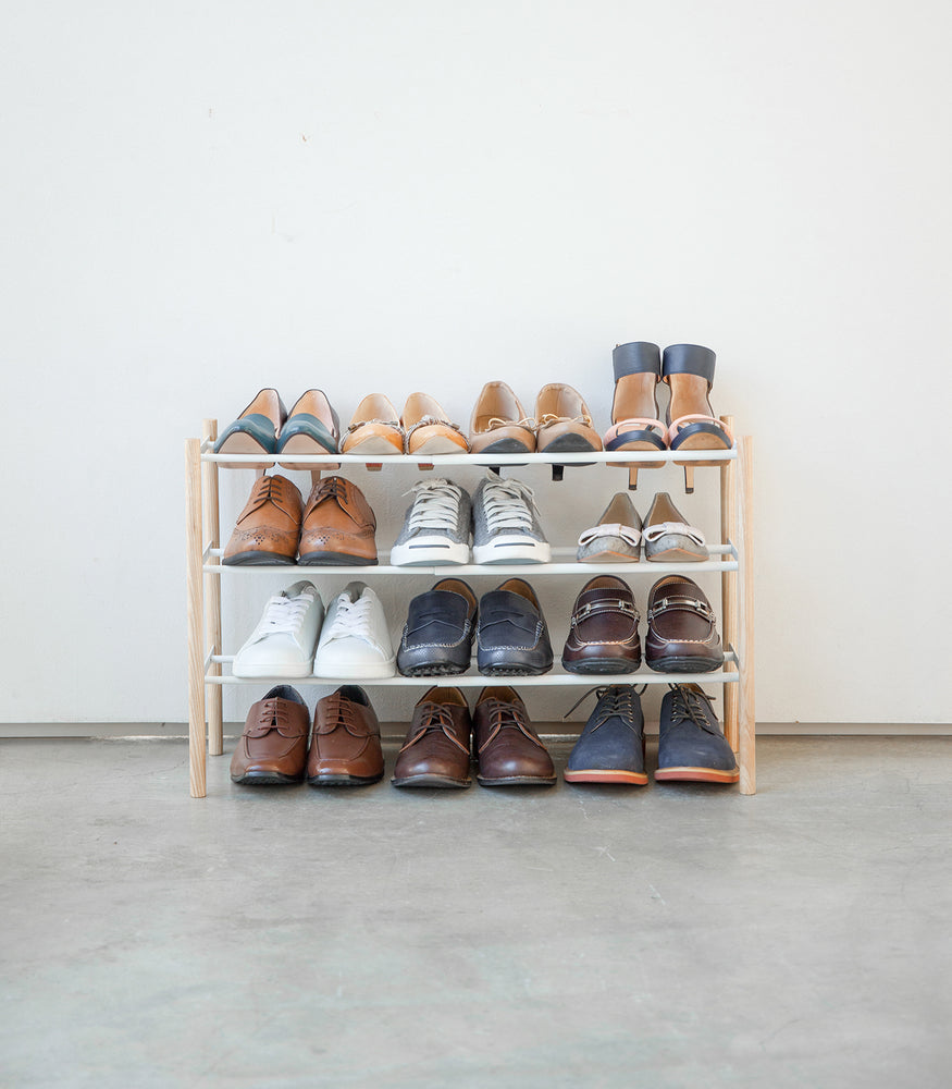 View 4 - Front view of Expandable Shoe Rack holding shoes by Yamazaki Home.