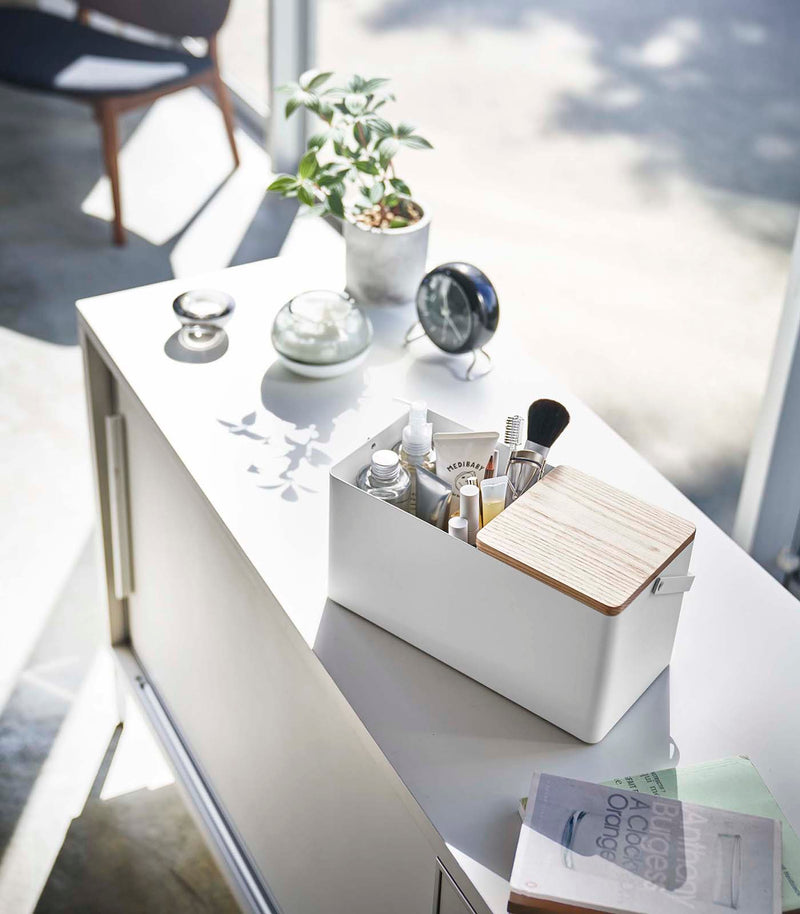 Closed white Makeup Organizer holding makeup on countertop by Yamazaki Home.