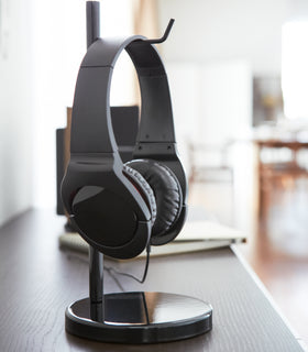 Close up side view of black Headphone Stand displaying over-ear headphones by Yamazaki Home. view 7