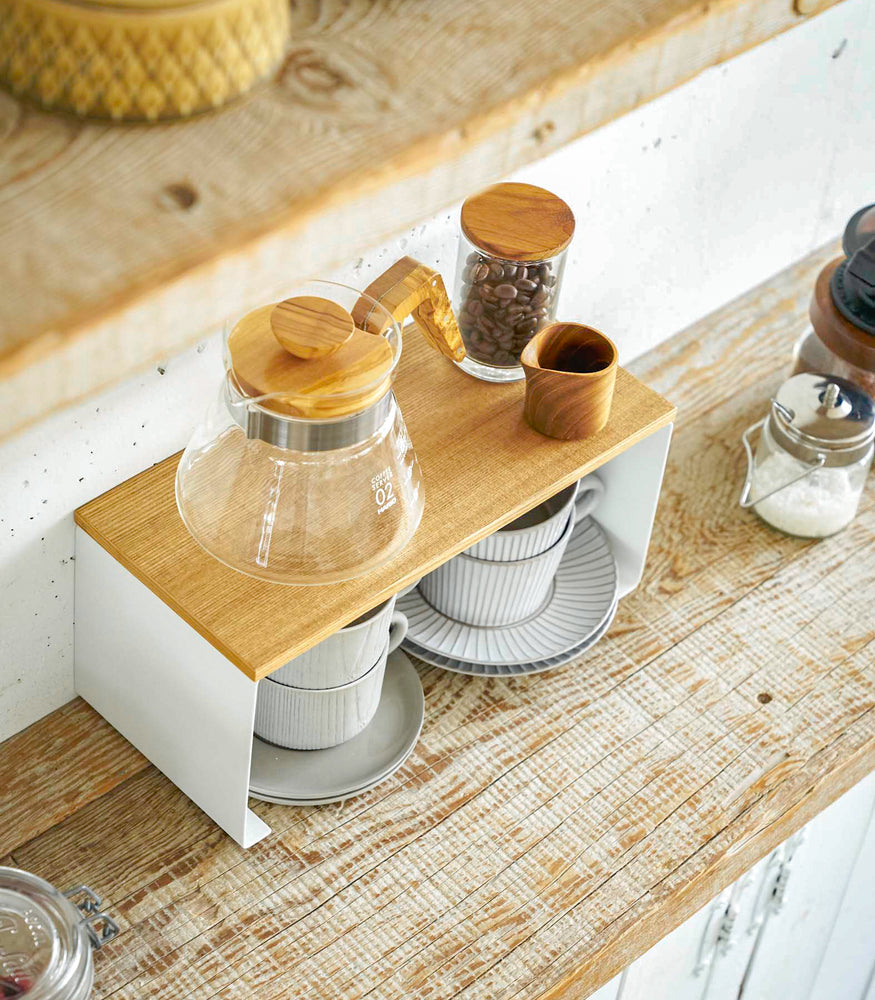 View 3 - Aerial view of white Stackable Countertop Shelf holding coffee pot and brewing equipment by Yamazaki Home.