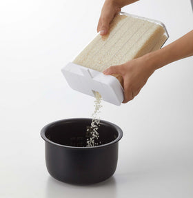 White Storage Container pouring rice into bowl on white background by Yamazaki Home. view 6