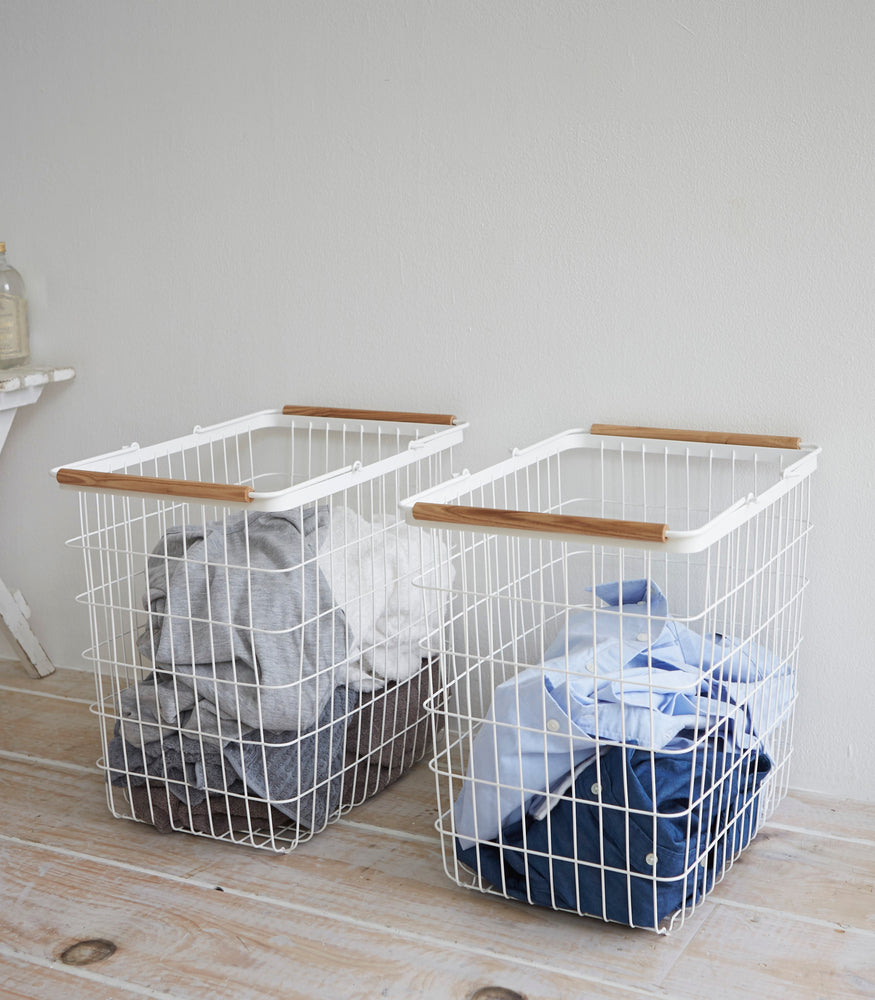 View 9 - Wire Laundry Baskets holding laundry by Yamazaki Home.