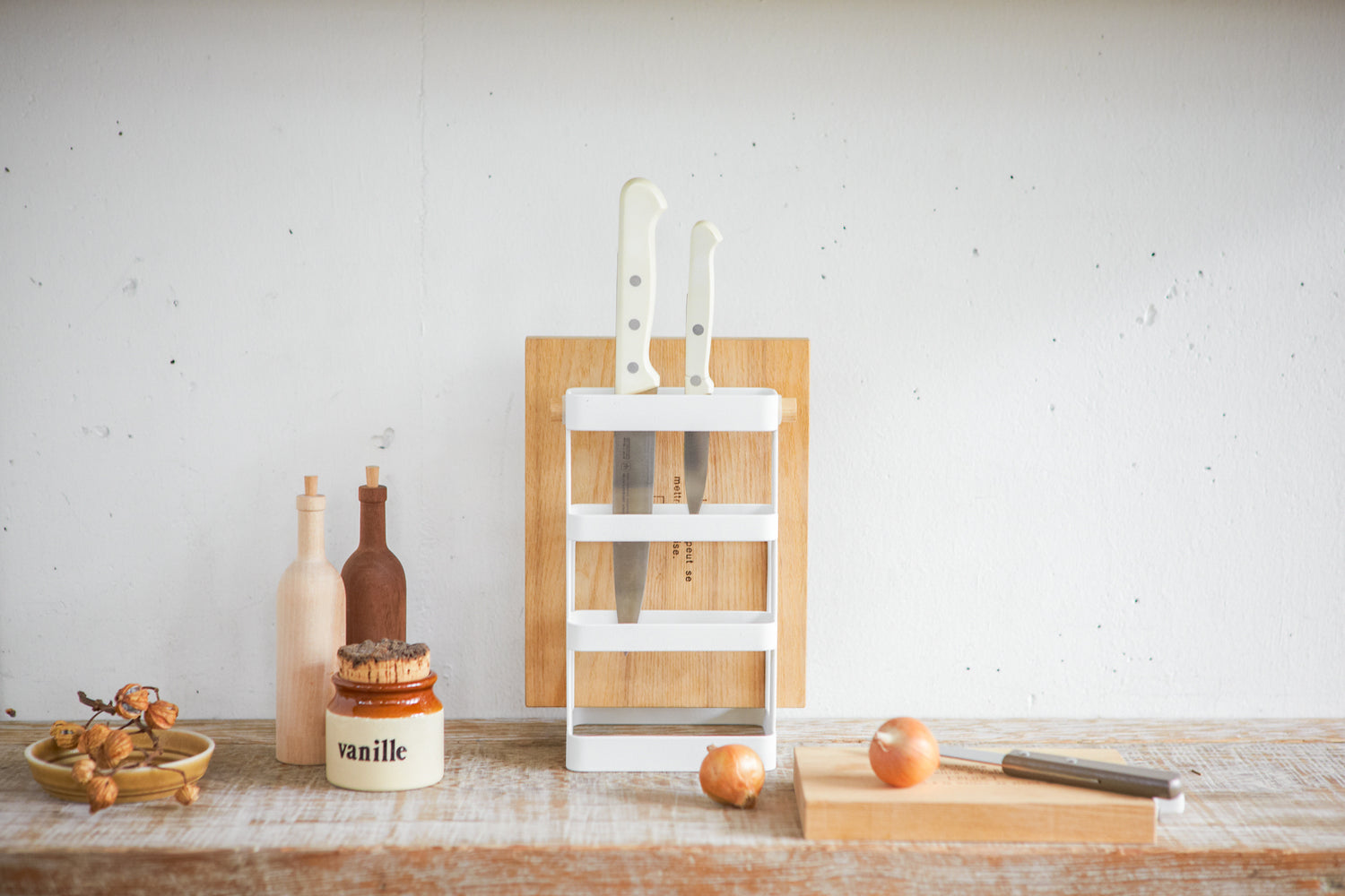 View 4 - Front view of white Knife & Cutting Board holding knives and cutting board on shelf by Yamazaki Home.