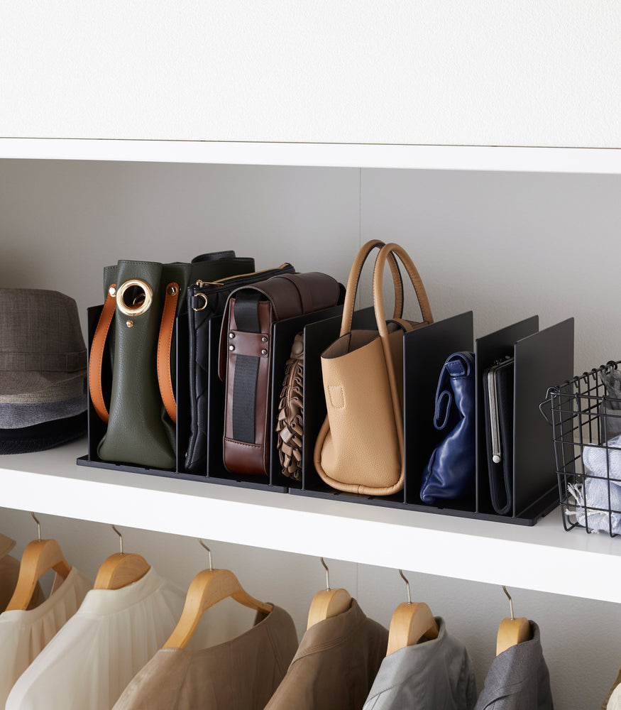 View 8 - Black Bag Organizer with Customizable Dividers displaying purses in closet by Yamazaki Home.