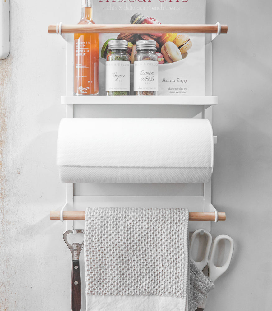View 6 - Front view of white Magnetic Organizer holding towels, spices, and cookbook by Yamazaki Home.