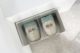 Aerial view of White Rolling Diaper Stacker holding diapers.  view 6