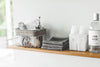 Wall-Mounted Shelf displaying cleaning items by Yamazaki Home.