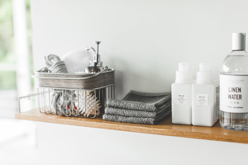 Wall-Mounted Shelf displaying cleaning items by Yamazaki Home.