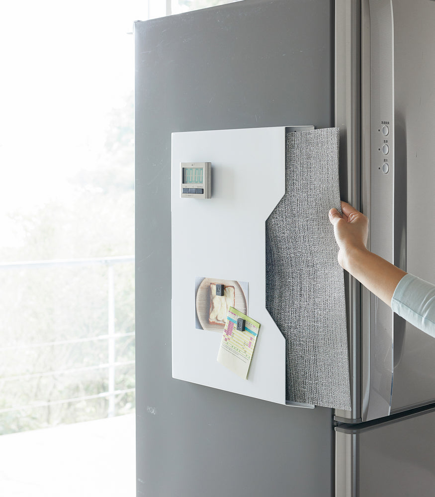 View 4 - White Magnetic Placemat Organizer holding mats on kitchen fridge by Yamazaki home.