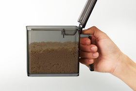Side view of black large Pantry Organizer holding brown sugar on white background by Yamazaki Home. view 18