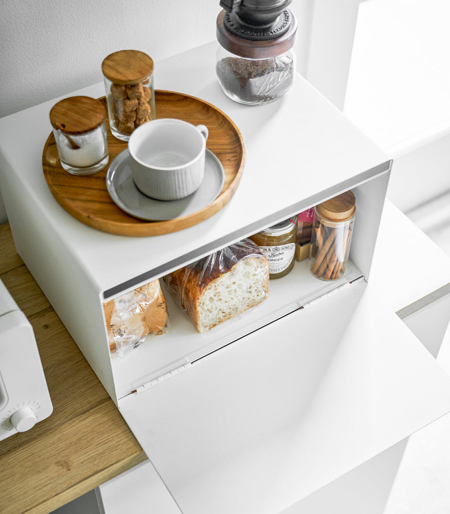 View 3 - Aerial view of white Bread Box holding food items on kitchen shelf by Yamazaki Home.