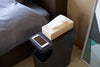 Aerial view of black Side Table Trash Can displaying tissue box and phone in bedroom by Yamazaki Home.