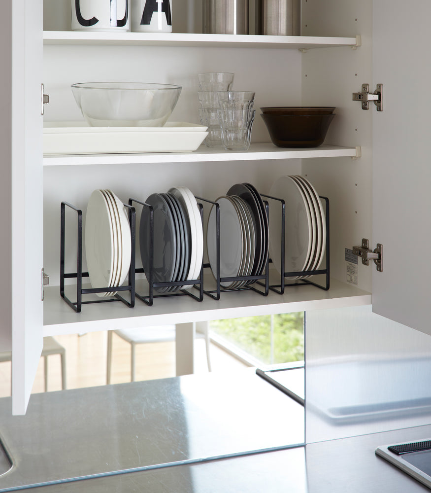 View 8 - Black Dish Storage Rack holding plates in kitchen cabinet by Yamazaki Home.