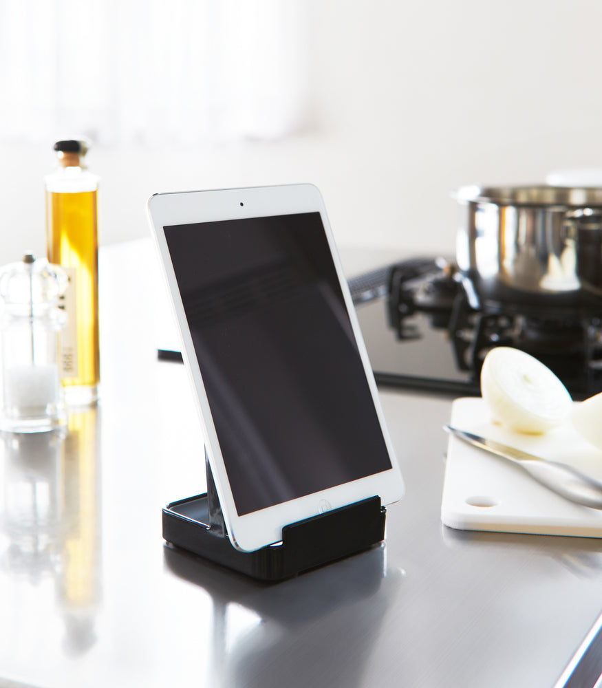 View 10 - Black Lid & Ladle Stand holding tablet in kitchen by Yamazaki Home.