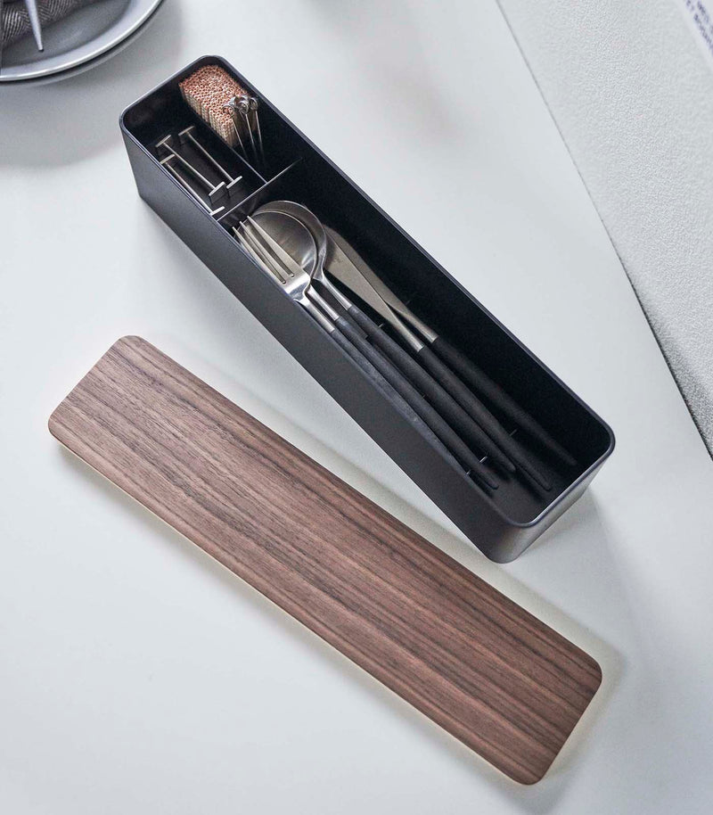 Aerial view of black Utensil Case holding utensils and items by Yamazaki Home.
